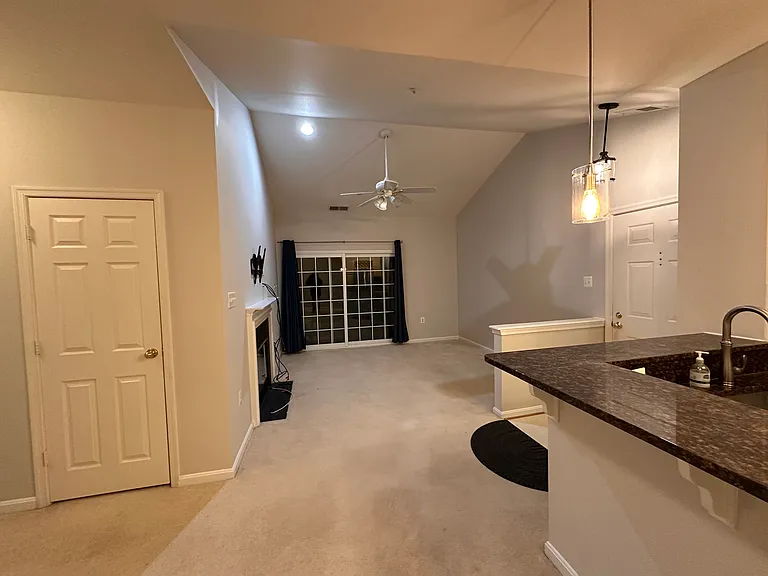 Dining area overlooking the living room with balcony access
