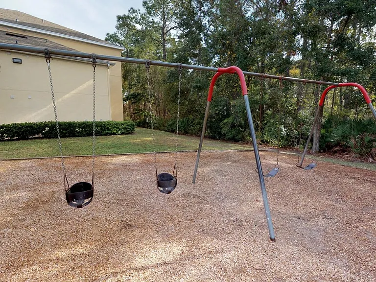 Playground swings at Gregory Cove in Jacksonville, FL