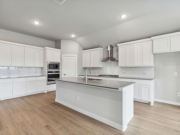 Kitchen in the Gilmour home plan by Trophy Signature Homes