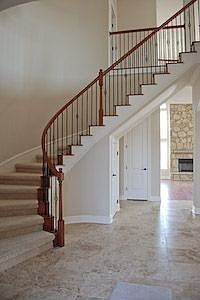Grand winding staircase as you enter thru the courtyard