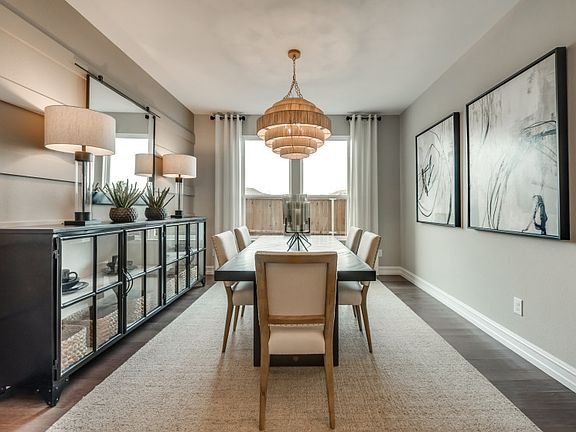 Formal dining room with large windows