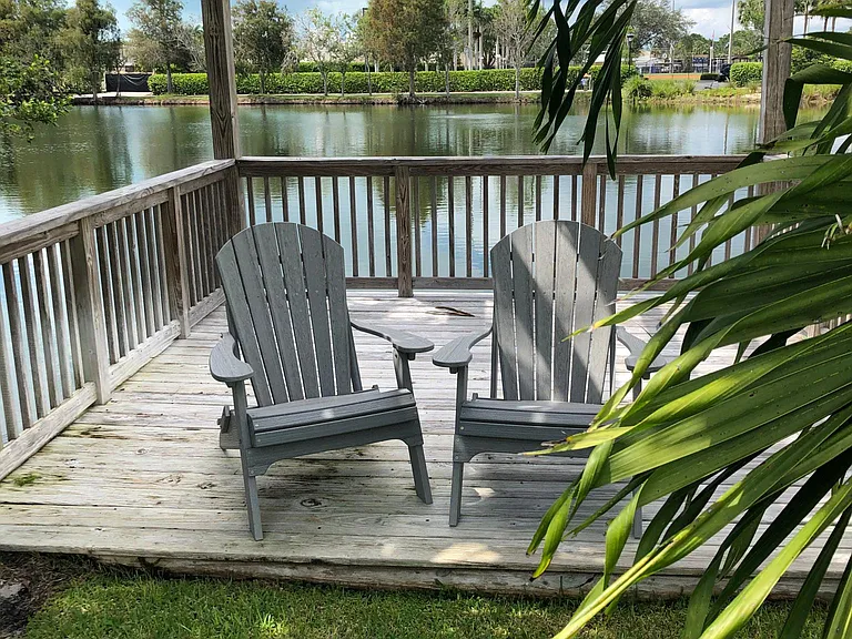 Deck and house overlook lake