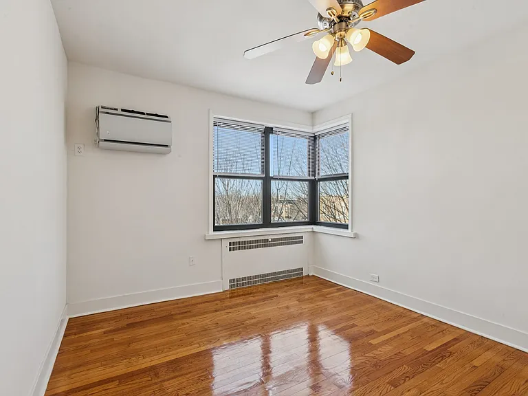 Primary Bedroom with built in wall A/C unit