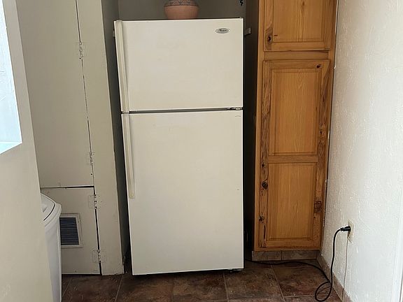 Cottage entrance area and refrigerator