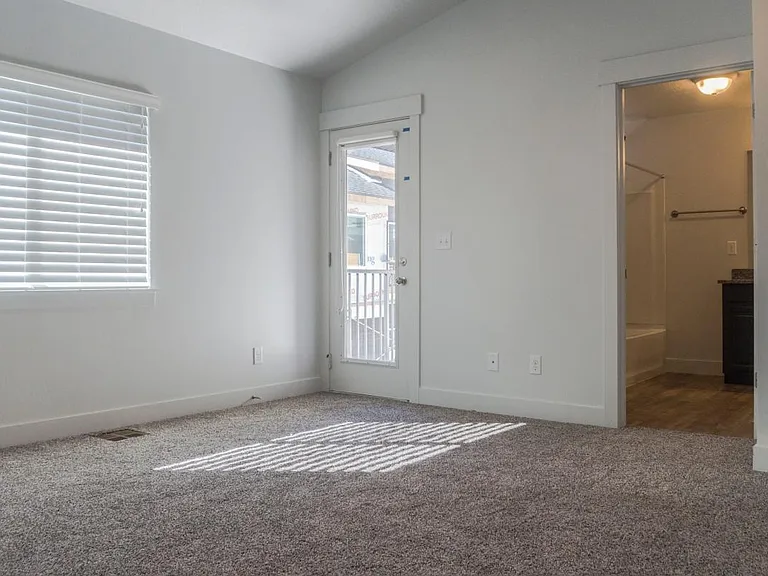 Master Bedroom. Balcony door to the left. Master Bath on the