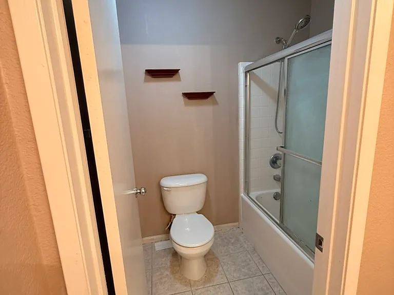Bathroom, first floor, off hallway of bedrooms 1, 2, and 3.
Two sinks, shower tub combo
