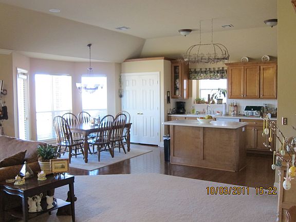 Living room to back door and covered porch