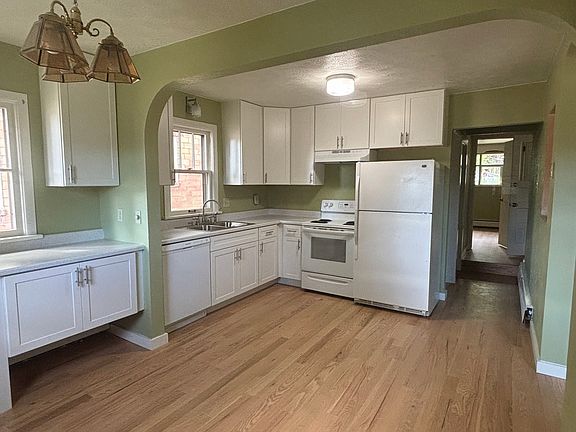Brand new cabinets and flooring; open kitchen and dining room.