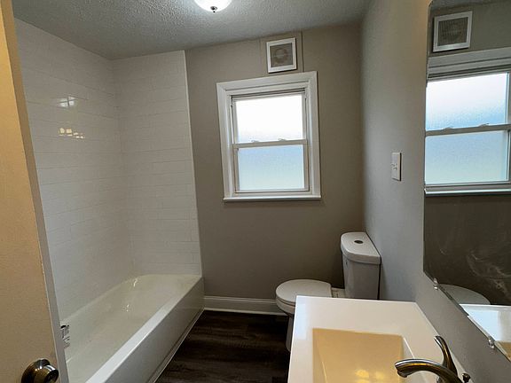 Remodeled bath with subway tile surround
