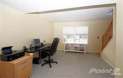 The Formal Living Room has wall to wall carpet plus Plantation shades.