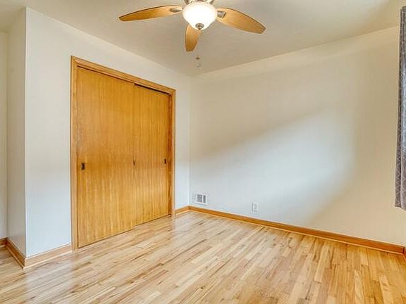 Bedroom 1 - furnished with bed, side table and lamp