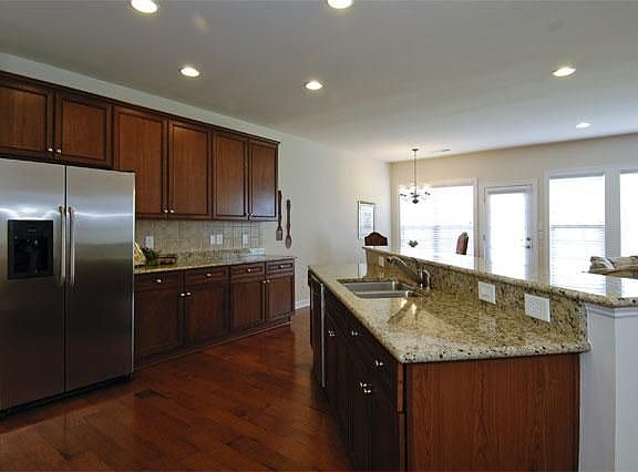 Spacious Kitchen with granite countertops and breakfast bar. 