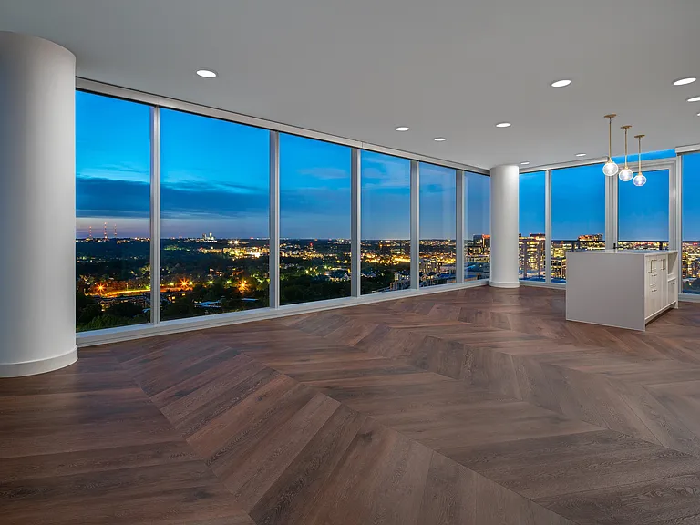 Floor-to-ceiling windows frame stunning views in every direction.