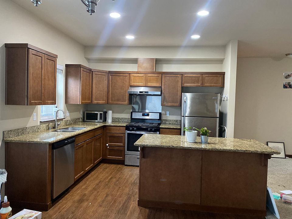 Kitchen comes with all essential appliances and has lots of storage space with large kitchen island
