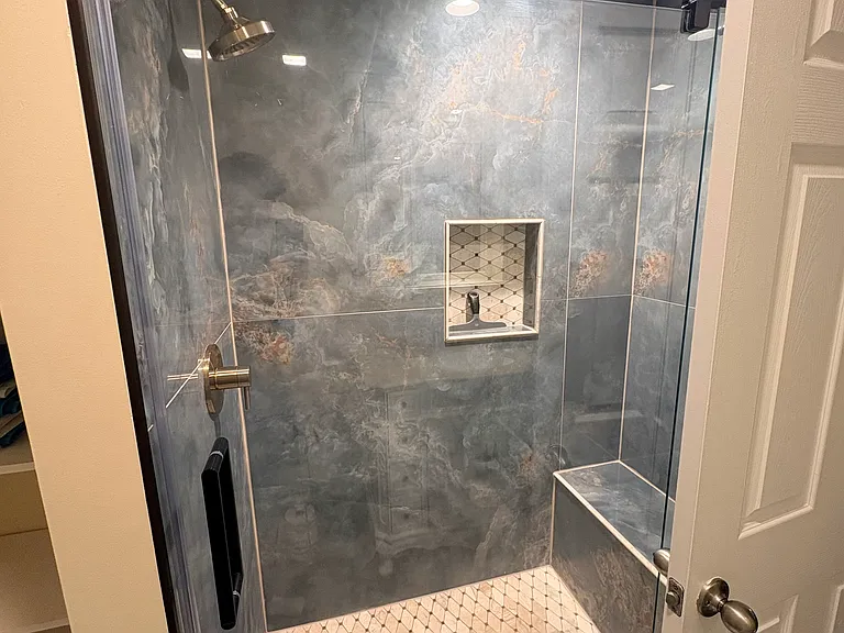 Beautiful walk in shower with bench seat.