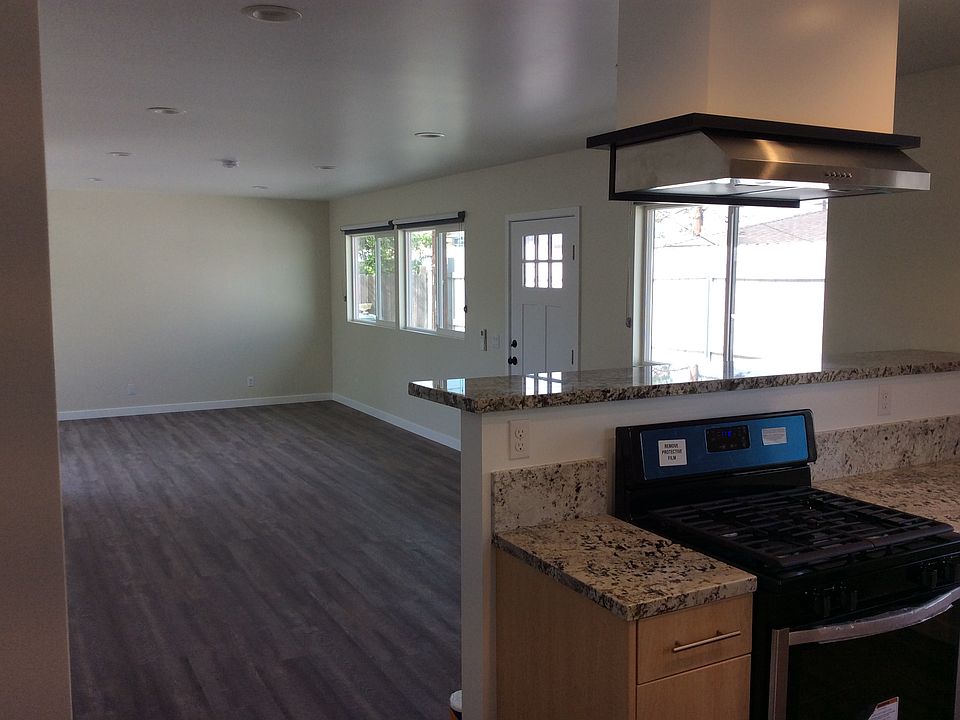VIEW FROM THE KITCHEN TO THE LIVING ROOM. NICE OPEN FLOOR PLAN. LOTS OF NATURAL LIGHT.