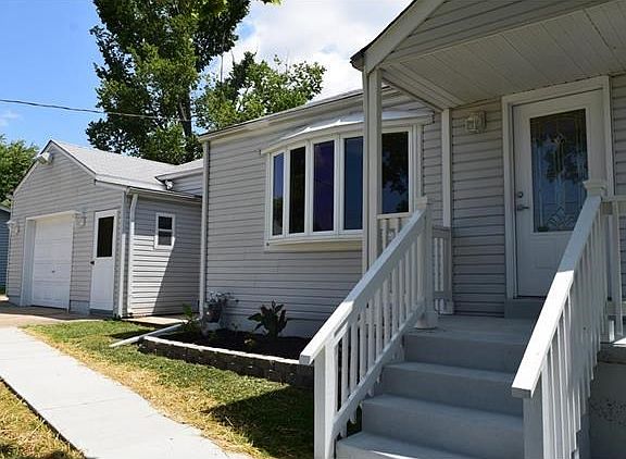 Fresh paint and a new concrete walkway to the front entrance. Come on in!