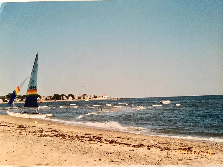 6 houses to large private beach with lifeguards, and a boat rack for rent.