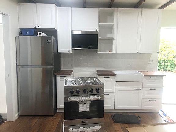 New oven, countertops, farm house sink.