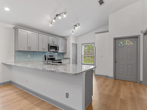 Kitchen and front door
Vaulted ceiling