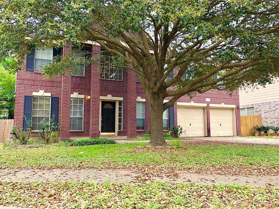 Front of home with beautiful large shade tree!