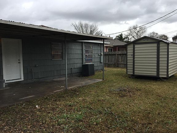covered back patio and shed