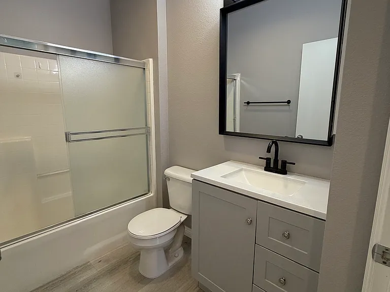 Beautifully remodeled guest bathroom with modern finishes.