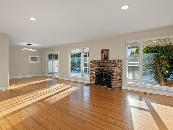 Bright and cheerful family room with fireplace