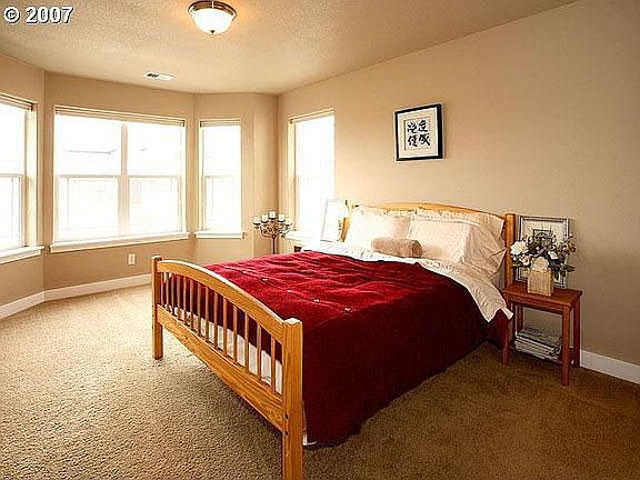 Light-filled front bedroom with large, walk-in closet