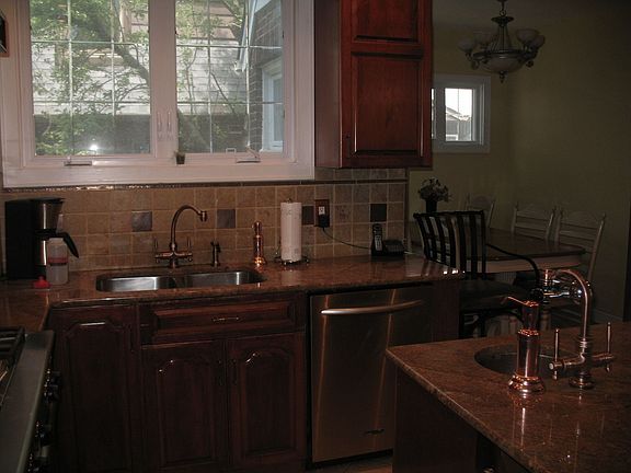 Marble backsplash and in-line wine cooler