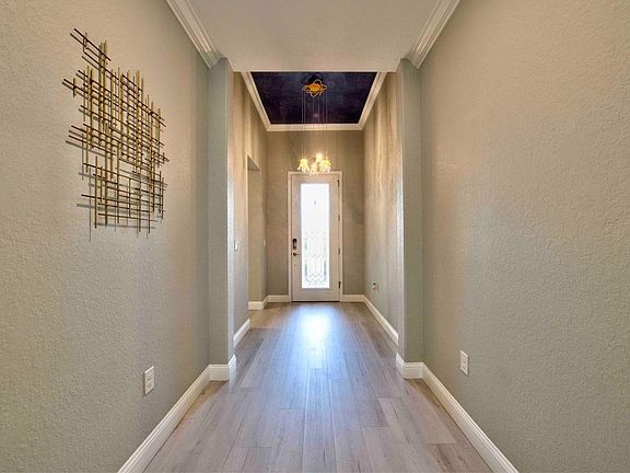 Upon entry you can enjoy decorative base & crown that runs along the 12/9 foot ceiling.