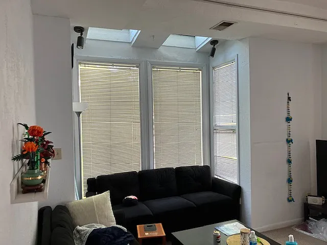 Three skylights flood the space with natural light throughout the day
