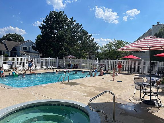 Community pool with hot tub 