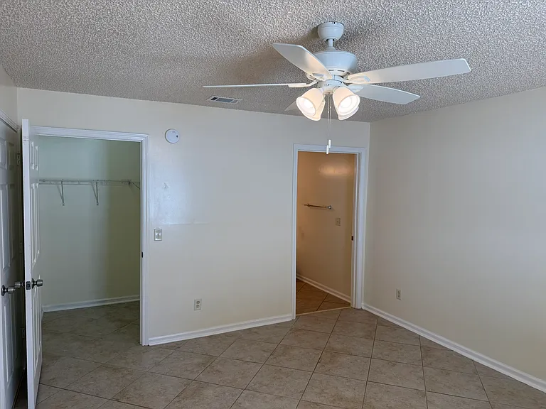 Master bedroom with its own closet and bathroom. NEW Ceiling fan has a separate switch for the fan and light.
