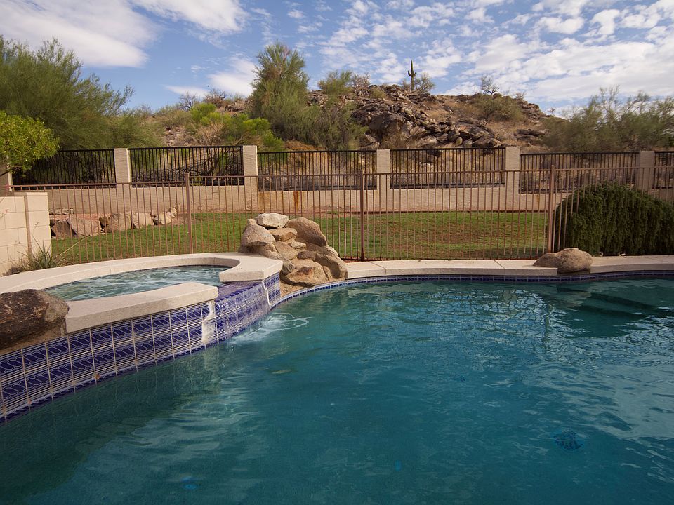 Backyard with unobstructed views of the preserve from the pool and spa