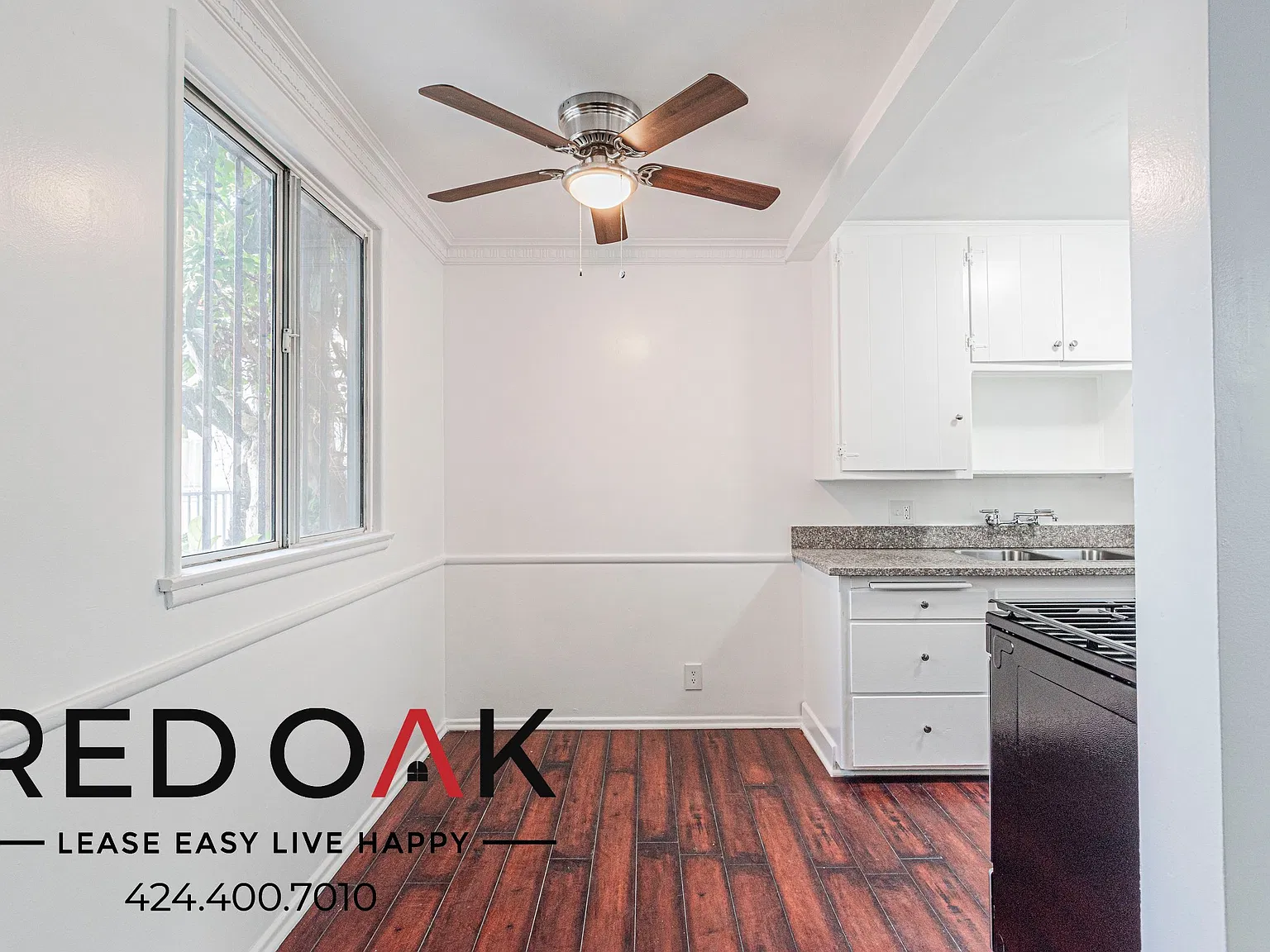 Cozy 1-Bed with Hardwood-Style Floors, On-Site Laundry and Parking Available in the Heart of Kore... — Photo 4
