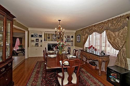 Large dining room, hardwood floors, fireplace