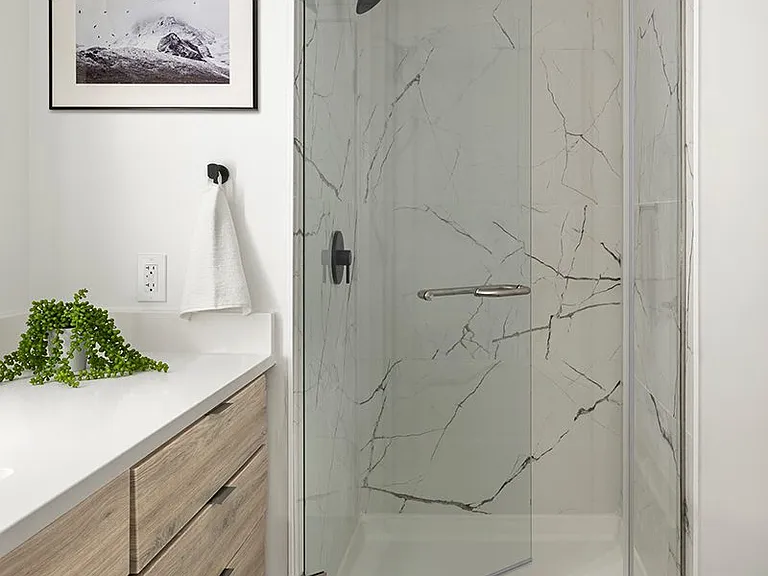 Apartment bathroom with wood-style flooring.