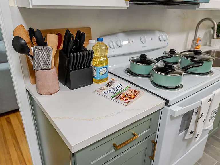 Cook like a pro with a high-quality pan in this fully equipped kitchen.