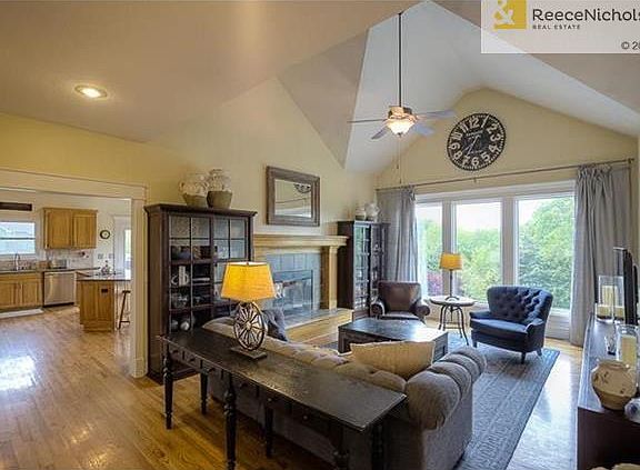 As you enter the home you are greeted by this amazing Great Room with vaulted ceiling, a wall of windows, see thru fireplace and conveniently located next to the kitchen.