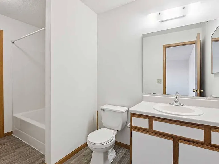 Bright, functional bathrooms offer a comfortable space to refresh and keep daily routines running smoothly.
