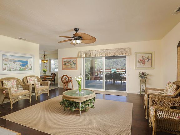 The spacious living room boasts beautiful wood floors and fabulous mountain views!