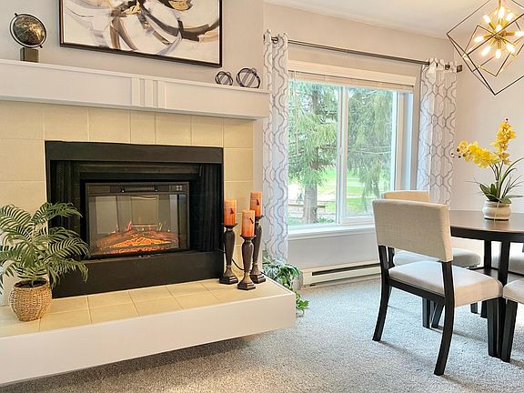 Electric fireplace adds warmth and ambiance.