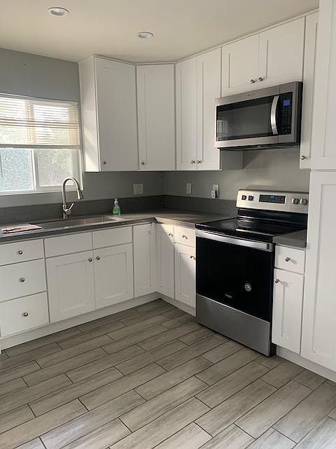 Quartz countertops, gourmet stove, large stainless sink