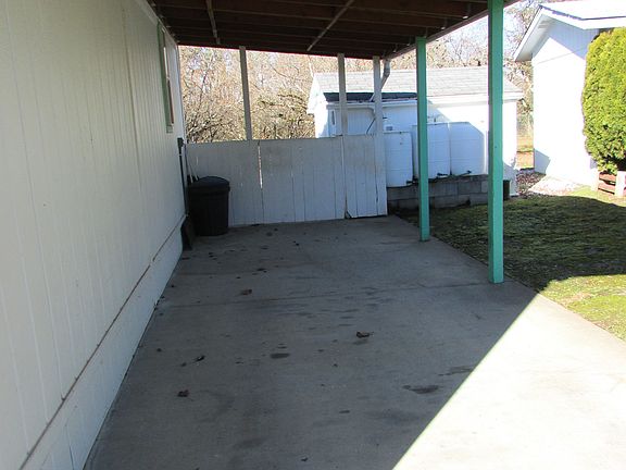 Carport and gate to backyard