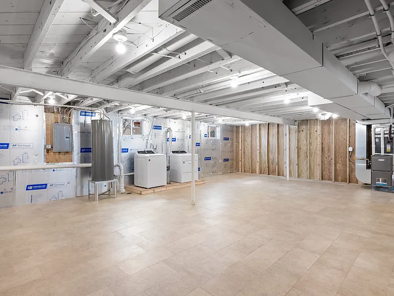 Washer and dryer in basement.