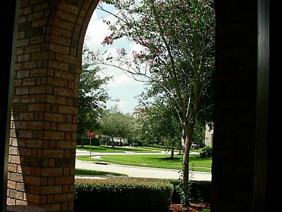 View from the covered porch to the lush landscaping.