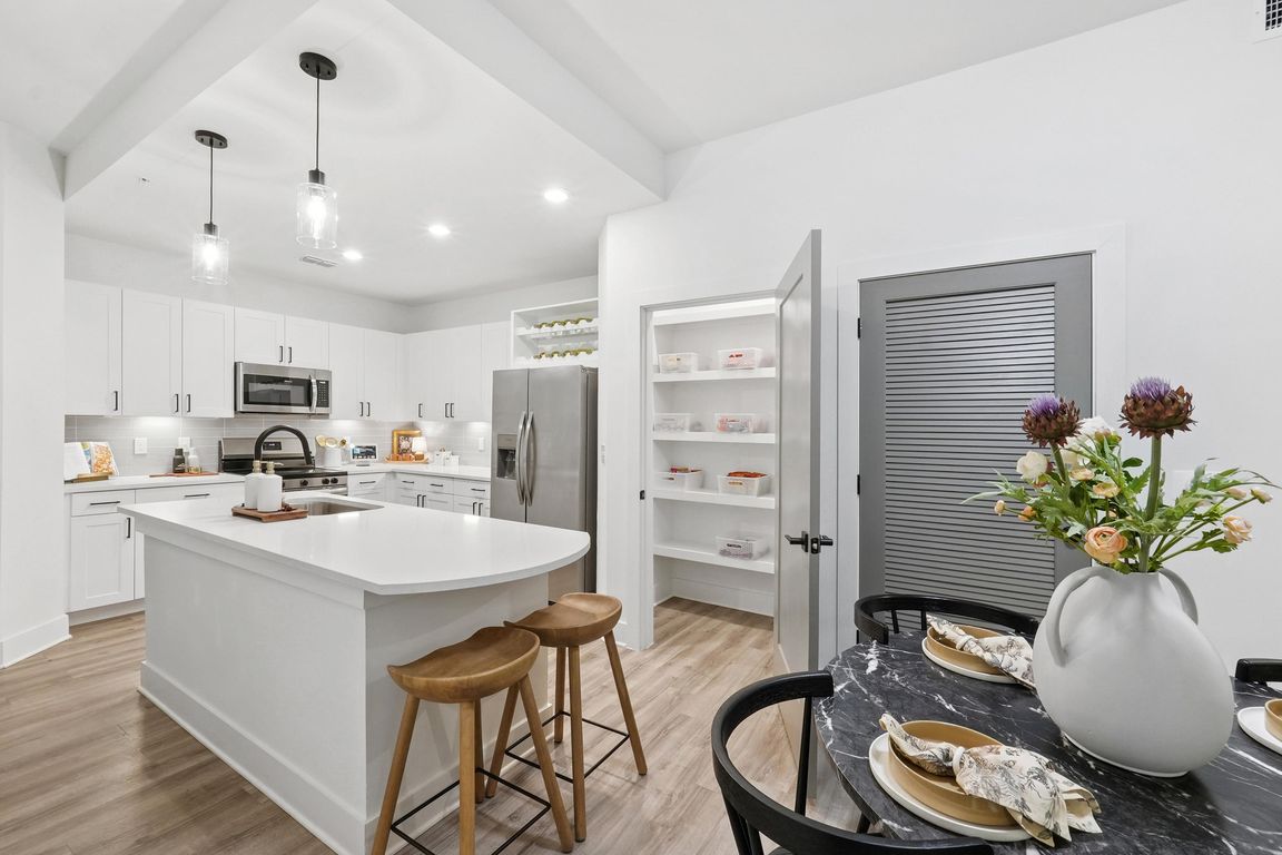 Kitchen with Quartz Countertop and Stainless Steel Appliances