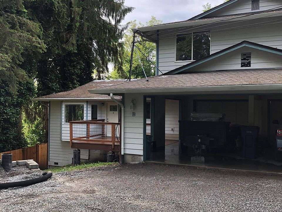 The unit is all one level. No adjoining walls. The available unit is the left side (left carport & left 1 car garage).