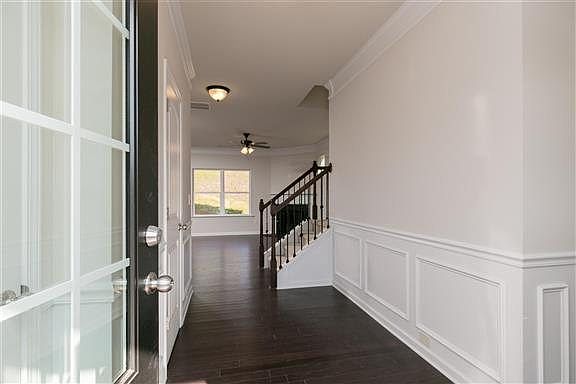 MODEL HOME PICTURED - Wide Entry Hallways with Chair Rail Wainscoting Included